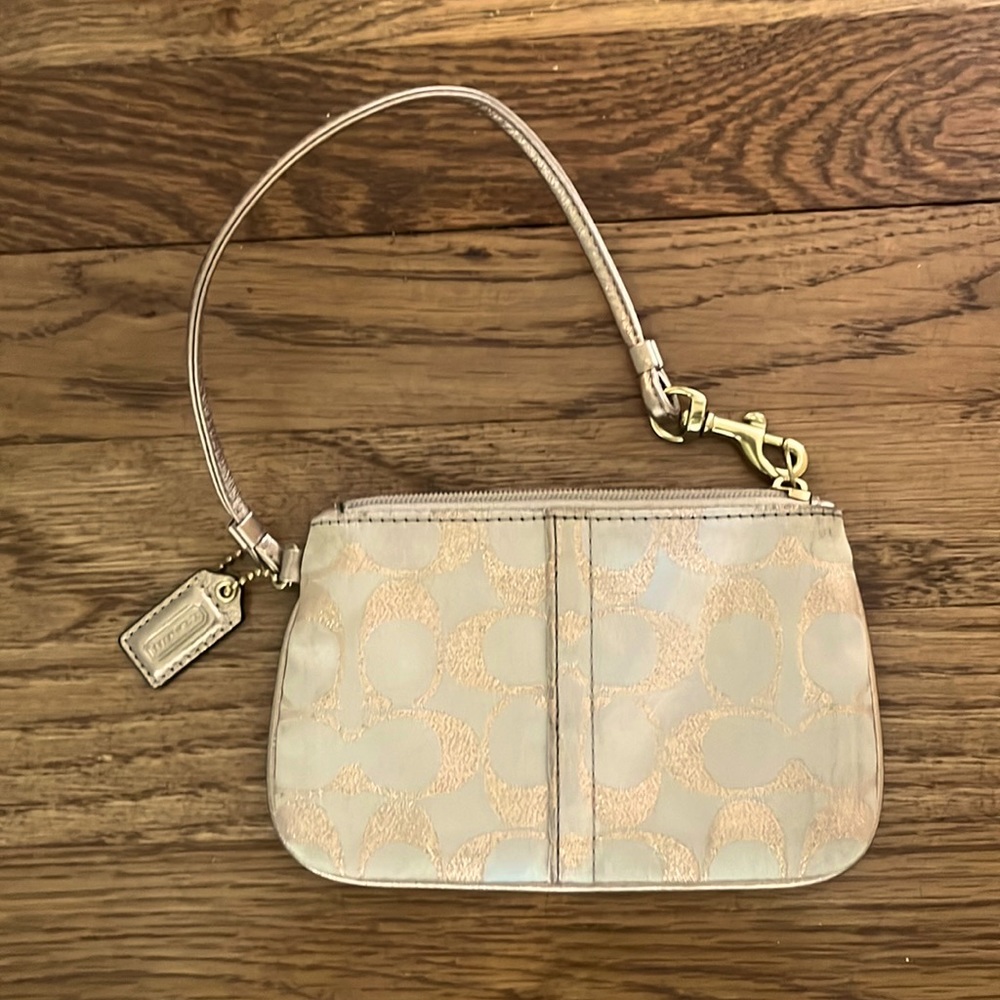Champagne-colored COACH Wristlet